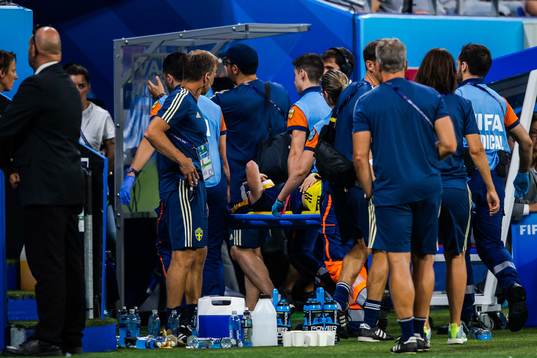 Kosovare Asllani of Sweden is carried of the pitch