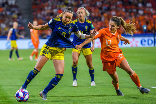 Kosovare Asllani of Sweden and Daniëlle Van De Donk of