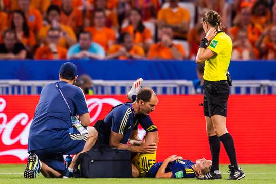 Elin Rubensson of Sweden receives treatment