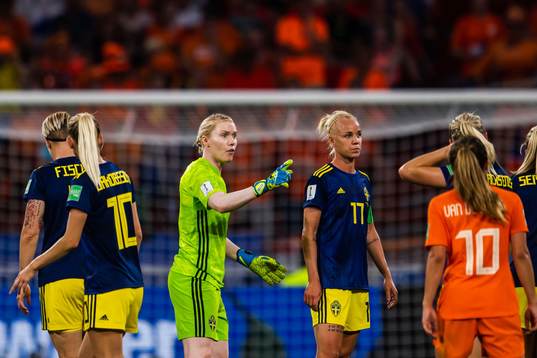 Goalkeeper Hedvig Lindahl and Caroline Seger of Sweden