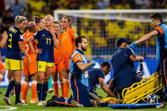 Kosovare Asllani of Sweden receives treatment