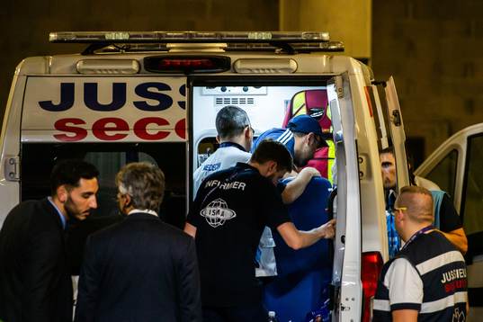 An ambulance and Houman Ebrahimi, doctor of Sweden