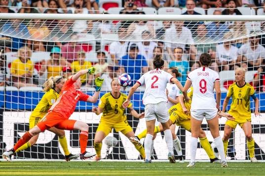Nilla Fischer and goalkeeper Hedvig Lindahl of Sweden saves