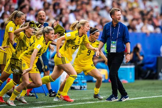 Substitutes of Sweden celebrate winning bronze