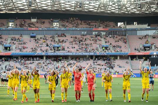 Players of Sweden celebrate winning bronze
