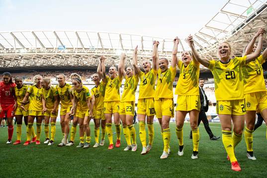 Players of Sweden celebrate winning bronze