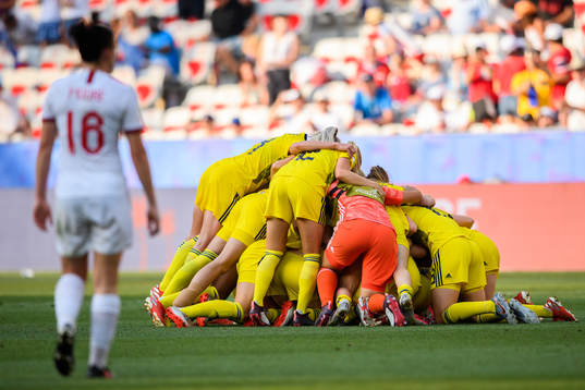 Players of Sweden celebrate winning bronze