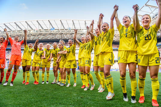 Players of Sweden celebrate winning bronze