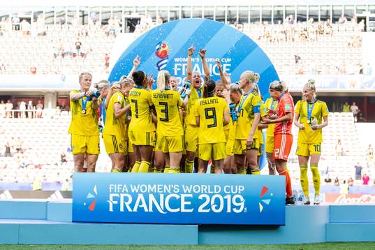 Players of Sweden celebrate with their bronze medals