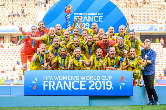 The players of Sweden celebrate with their bronze medals