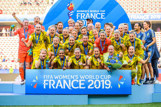 The players of Sweden celebrate with their bronze medals