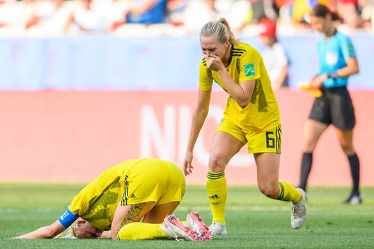 Caroline Seger and Magdalena Eriksson of Sweden celebrate