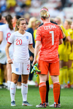 Karen Carney of England and goalkeeper Hedvig Lindahl of