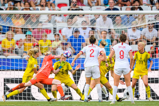 Nilla Fischer and goalkeeper Hedvig Lindahl of Sweden saves