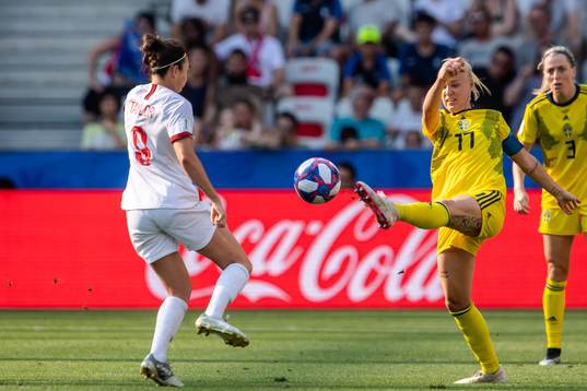 Jodie Taylor of England and Caroline Seger of Sweden