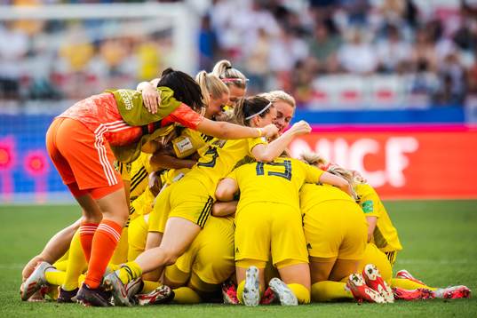 Players of Sweden celebrate winning bronze
