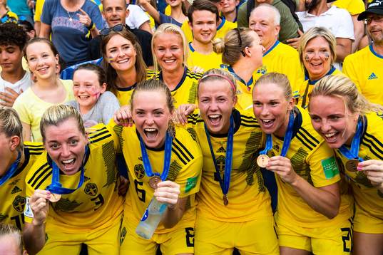 Players of Sweden celebrate with their bronze medals