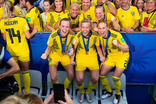 Players of Sweden celebrate with their bronze medals