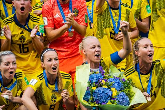 Kosovare Asllani and Caroline Seger of Sweden celebrate