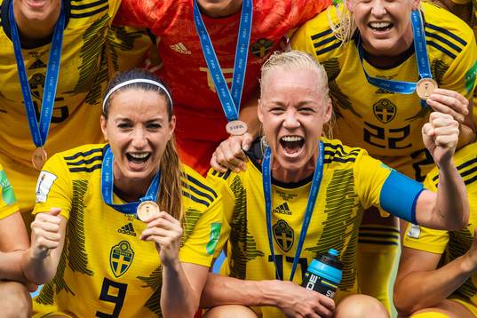 Kosovare Asllani and Caroline Seger of Sweden celebrate