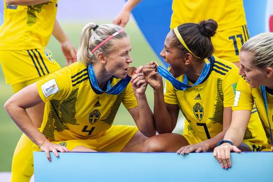 Hanna Glas and Madelen Janogy of Sweden celebrate winning