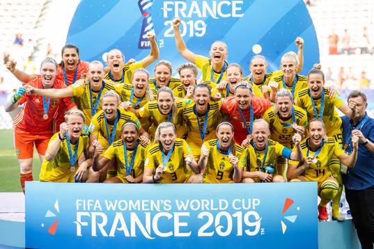 Players of Sweden celebrate with their bronze medals