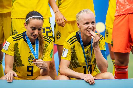 Kosovare Asllani and Caroline Seger of Sweden celebrate