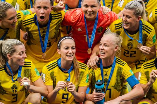 Kosovare Asllani and Caroline Seger of Sweden celebrate