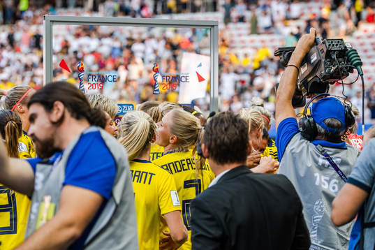 Players of Sweden celebrate with Caroline Seger , not