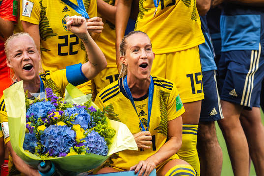 Caroline Seger and Julia Roddar of Sweden celebrate
