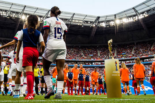 Crystal Dunn of USA next to the trophy