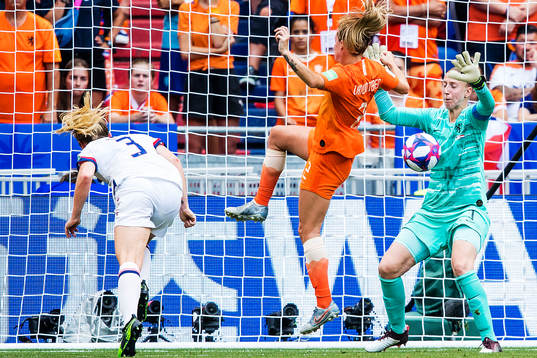 Samantha Mewis of USA and goalkeeper Sari Van Veenendaal of