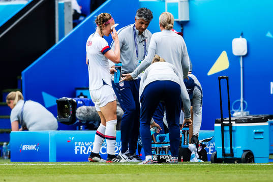 Rebecca Sauerbrunn of USA gets help