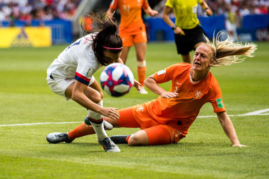 Stefanie Van Der Gragt of Netherlands and Alex Morgan of USA