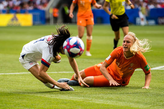 Stefanie Van Der Gragt of Netherlands and Alex Morgan of USA