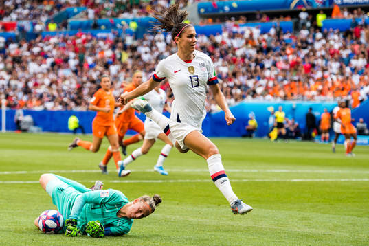 Alex Morgan of USA and goalkeeper Sari Van Veenendaal of