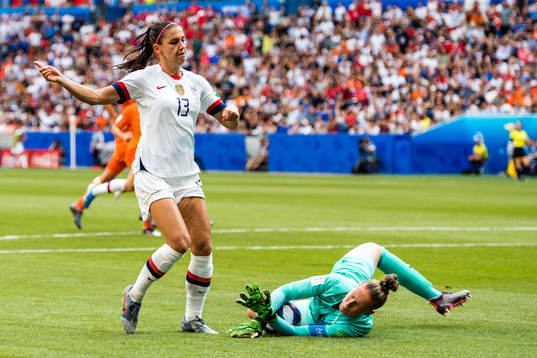 Alex Morgan of USA and goalkeeper Sari Van Veenendaal of