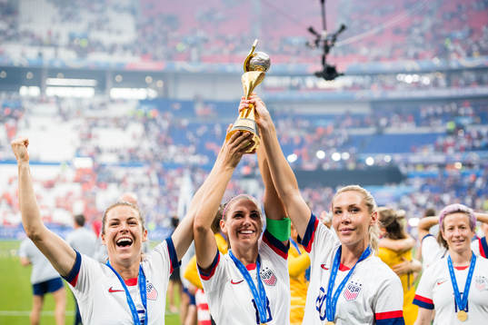 Kelley O'Hara, Ashlyn Harris and Alexandra Long of USA