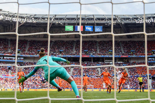 Rose Lavelle of USA scores the 2-0 goal against goalkeeper