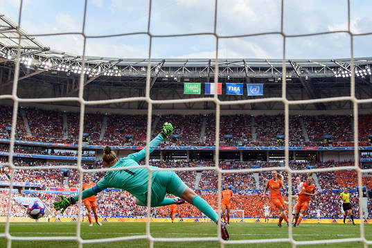 Rose Lavelle of USA scores the 2-0 goal against goalkeeper