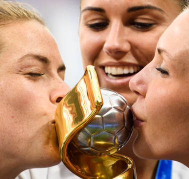 Kelley O'Hara, Ashlyn Harris and Alexandra Long of USA