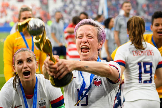 Megan Rapinoe of USA celebrates with the trophy
