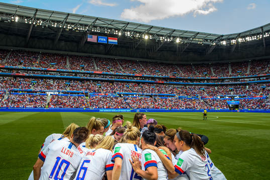 The players of USA form a huddle