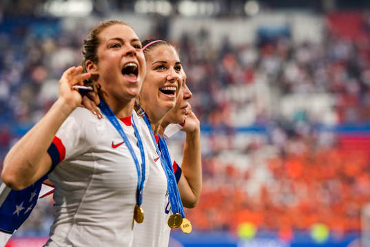 Kelley O'Hara and Alex Morgan of USA celebrate