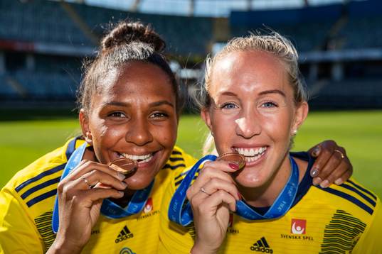 Madelen Janogy and Julia Roddar pose with their medals