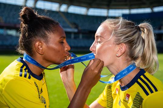 Madelen Janogy and Julia Roddar pose with their medals