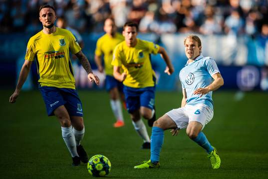 Jude Winchester of Ballymena United and Oscar Lewicki of