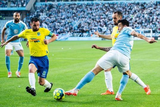 Behrang Safari of Malmö FF against Tony Kane and Jim Ervin
