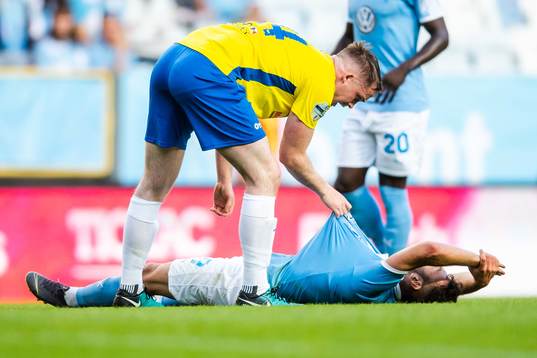 Andrew Burns of Ballymena United checks in