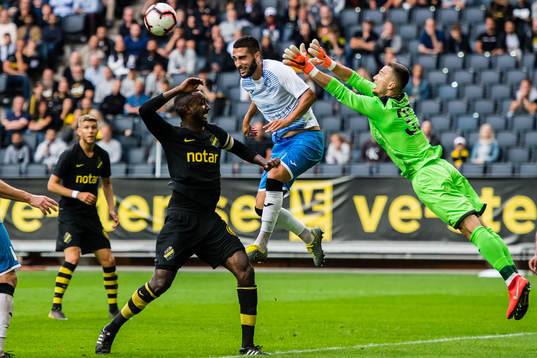 Henok Goitom of AIK and goalkeeper Dmitri Abakumov of